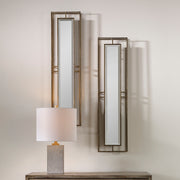 Pair of gold wall mirrors from the Rutledge set by Uttermost, featuring elegant round frames with a polished gold finish.