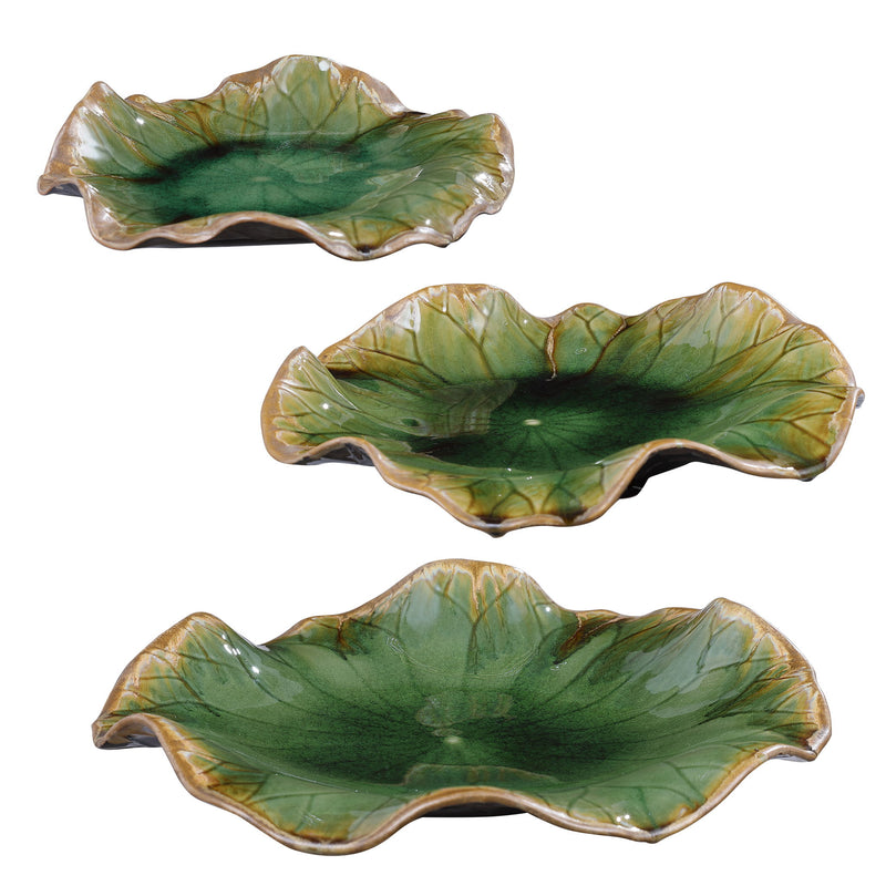 Set of three ceramic wall decor pieces by Uttermost, featuring modern abstract designs for stylish wall accents.