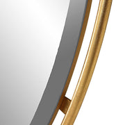 Gold round accent mirror by Uttermost, featuring a sleek, modern design with a polished gold finish and a smooth circular frame.