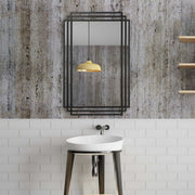 Uttermost Amherst wall mirror with a sleek, modern frame, hanging on a wall, showcasing elegant home decor.