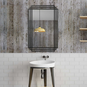 Uttermost Amherst wall mirror with a sleek, modern frame, hanging on a wall, showcasing elegant home decor.