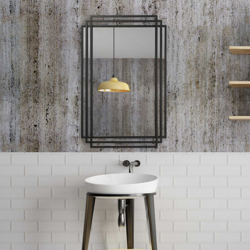 Uttermost Amherst wall mirror with a sleek, modern frame, hanging on a wall, showcasing elegant home decor.