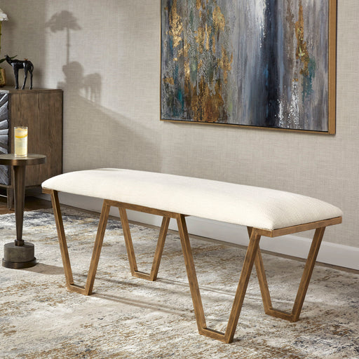 White geometric accent bench by Uttermost with angular metal legs and a modern design, ideal for stylish entryways or living spaces.