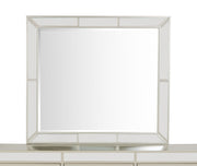 Elegant contemporary mirror by Glory Furniture with a sleek, modern frame, reflecting a stylish interior space.