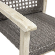 Set of two Noble House outdoor dining chairs with acacia wood frames, showcasing natural wood grain and comfortable seating.