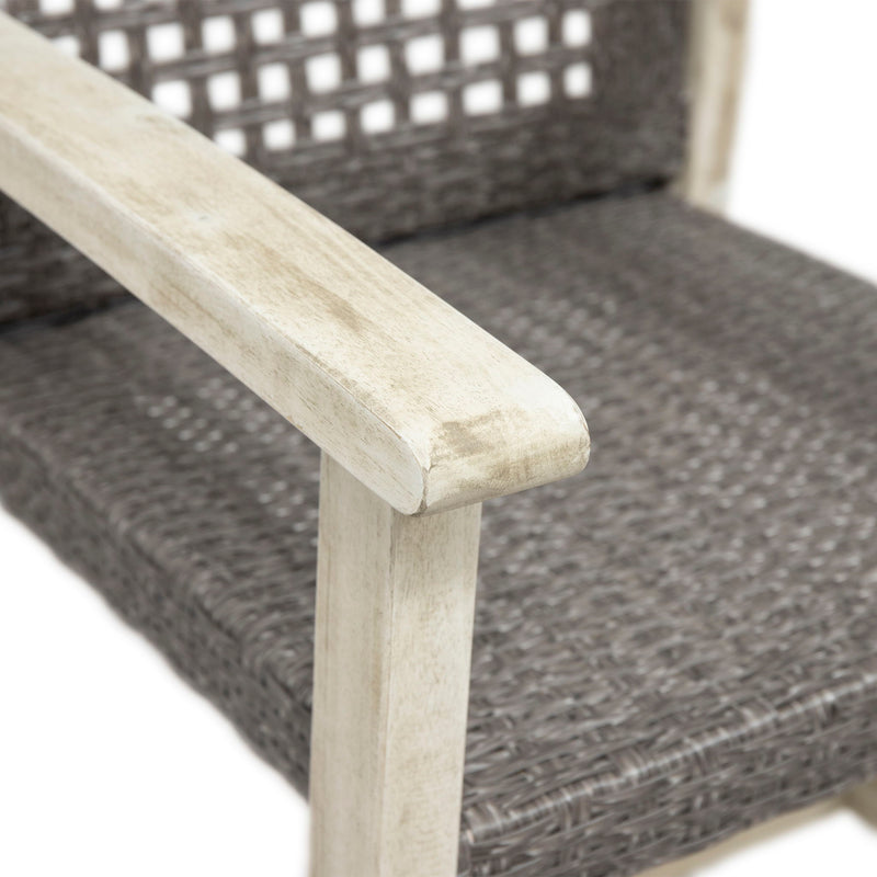 Set of two Noble House outdoor dining chairs with acacia wood frames, showcasing natural wood grain and comfortable seating.