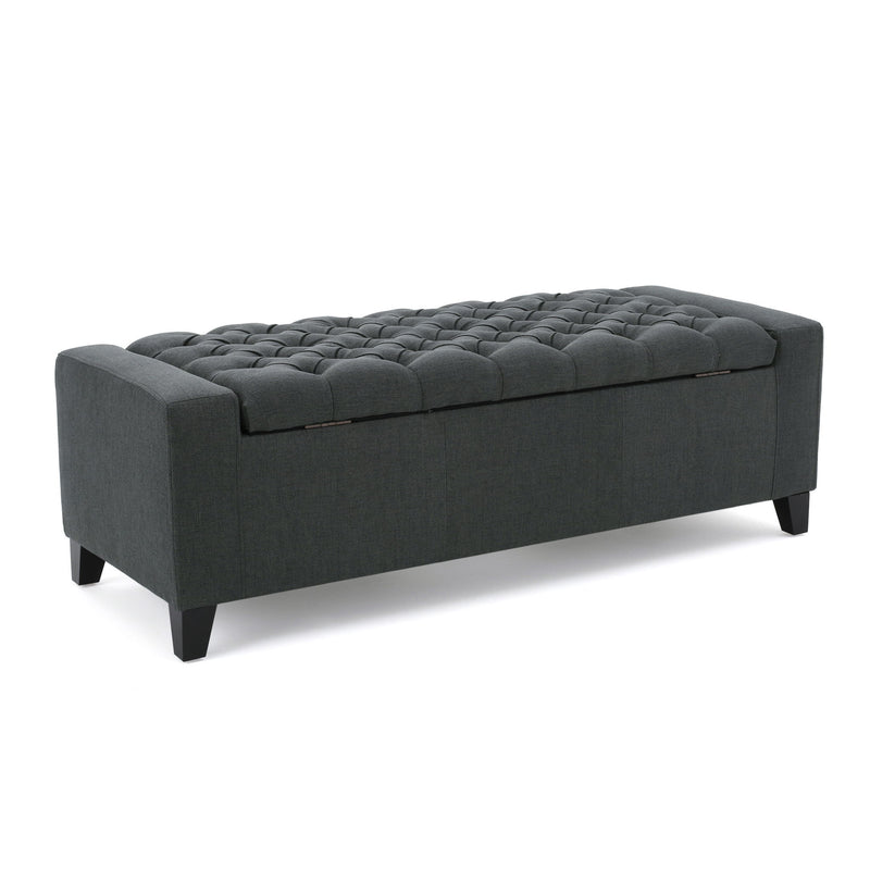 Dark gray contemporary storage ottoman with tufted top from Noble House, showcasing a soft fabric surface and functional storage space.