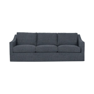 Classic Home Kipton upholstered stationary sofa with plush fabric and cushioned armrests in a cozy living room setting.
