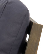 Noble House Samwell outdoor club arm chair with cushioned seat and backrest, weather-resistant design, in a cozy outdoor setting.