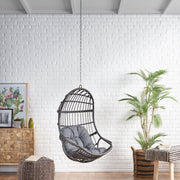 Rustic Noble House hanging basket chair with cushion, featuring woven design and cozy seating for outdoor or indoor relaxation.