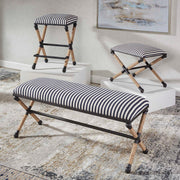 Black backless counter stool by Uttermost with a sleek design, suitable for counter height seating at 24-27 inches.