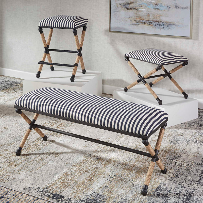 Black backless counter stool by Uttermost with a sleek design, suitable for counter height seating at 24-27 inches.
