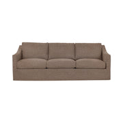 Classic Home Kipton upholstered stationary sofa with plush fabric and cushioned armrests in a cozy living room setting.