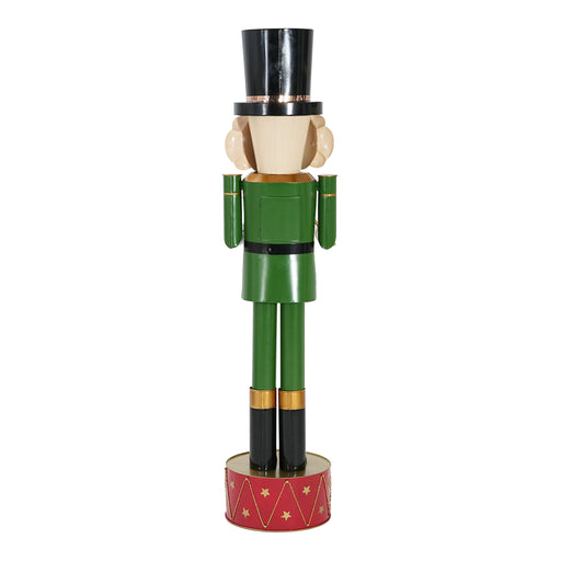 Noble House Nutcracker Christmas decor in green and red with festive holiday design on a wooden stand.