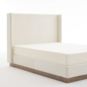 Minimalist upholstered wingback bed with wood base platform in neutral fabric, by House & Home Furniture.