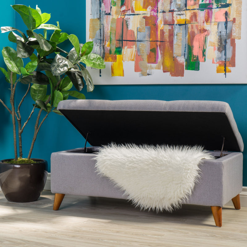 Light gray upholstered storage ottoman with lift-top and button tufted seat by Noble House, showcasing its padded top and storage space.