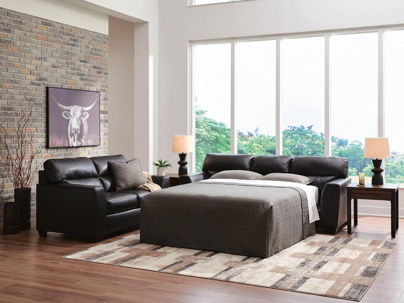 Midnight Queen Sofa Sleeper by Signature Design Ashley, featuring plush upholstery and a convertible sleeping surface.