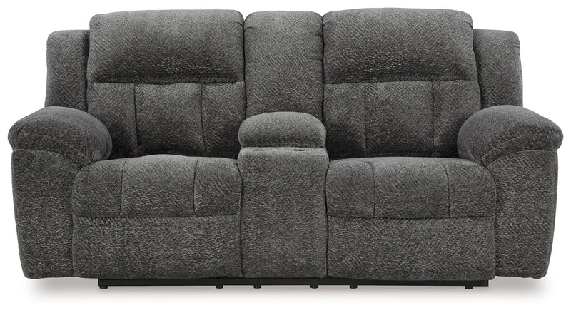 Reclining sofa from the Frohn living room set by Signature Design by Ashley®, showing plush fabric and padded armrests.
