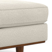 Simpli-Home Morrison handcrafted upholstered ottoman with soft fabric and wooden legs, versatile for living room decor.