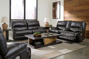 Signature Design by Ashley Mountainous reclining sofa and loveseat set in a modern living room with plush fabric and contemporary style.