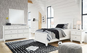 Signature Design by Ashley Fortman 6-piece panel bedroom set with bed frame, nightstands, dresser, mirror, and headboard in a modern style.