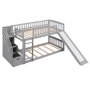 Gray DreamHaus twin over twin bunk bed with stairway, two drawers, and slide, featuring a sturdy frame and safety rails.