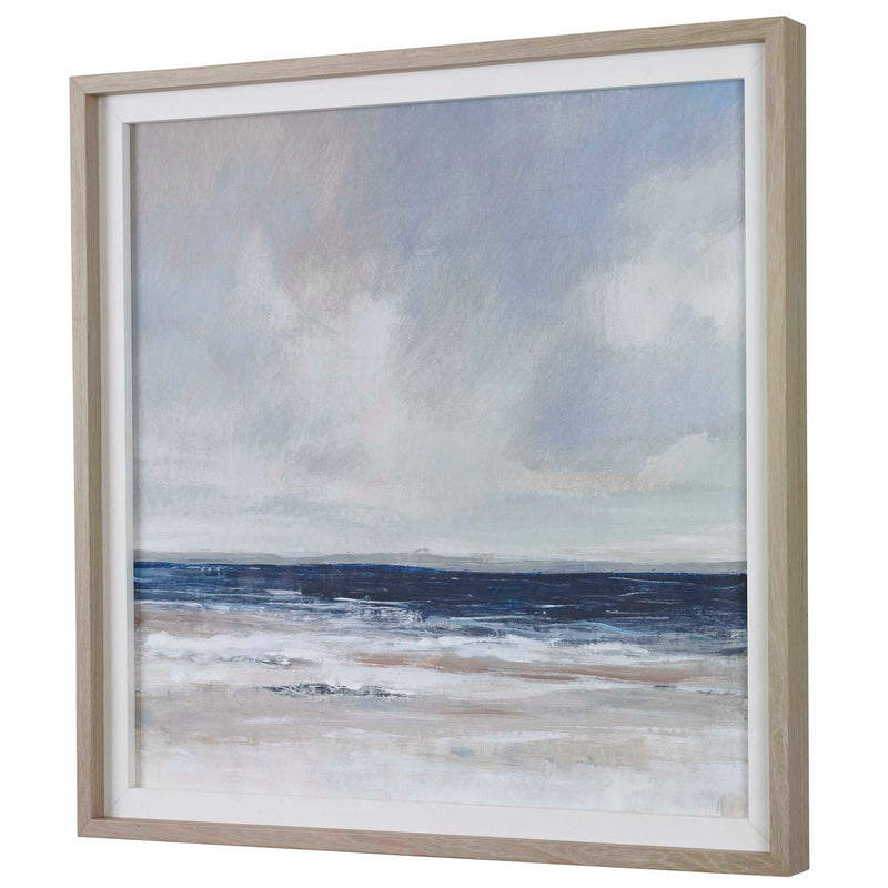 Uttermost Distant Land framed print featuring blue landscape artwork, displayed in a sleek frame.