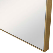 Uttermost Alexo square wall mirror with a sleek, modern frame, hanging on a wall, reflecting a room interior.