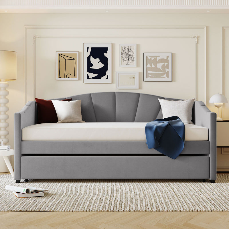 DreamHaus upholstered daybed sofa bed with wood slat base and hidden trundle bed, ideal for versatile living space.