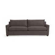 Olivia stationary sofa by Classic Home with plush fabric upholstery and a contemporary design, shown in a cozy living room setting.