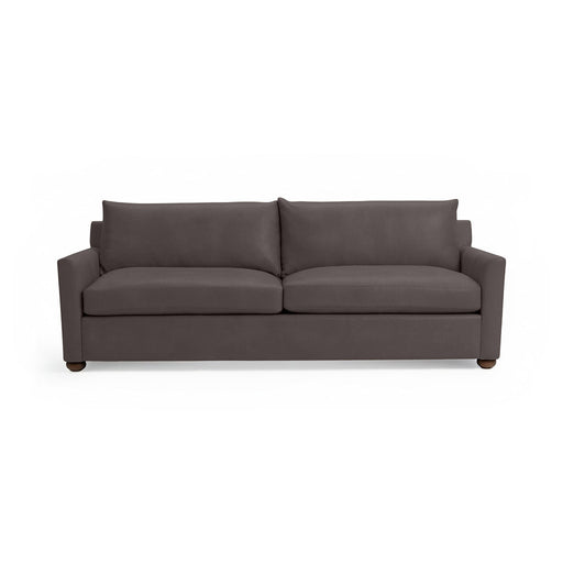 Olivia stationary sofa by Classic Home with plush fabric upholstery and a contemporary design, shown in a cozy living room setting.
