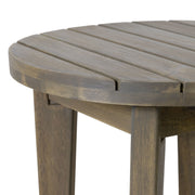 Noble House outdoor acacia wood side table with weather-resistant finish, featuring a square surface and sturdy legs.