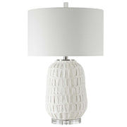 White textured table lamp by Uttermost with a modern design, featuring a sleek base and soft fabric shade for stylish illumination.