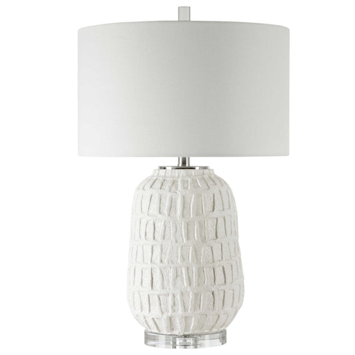 White textured table lamp by Uttermost with a modern design, featuring a sleek base and soft fabric shade for stylish illumination.