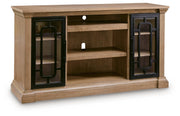 Signature Design by Ashley Wittenmyer TV stand with wood finish, open shelving, and storage compartments for modern living room.