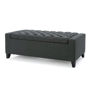 Dark gray Noble House storage ottoman with tufted top, serving as a contemporary accent piece and hidden storage solution.