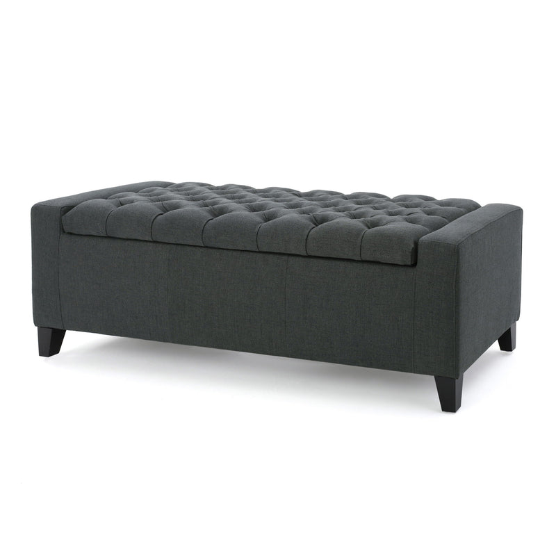Dark gray Noble House storage ottoman with tufted top, serving as a contemporary accent piece and hidden storage solution.