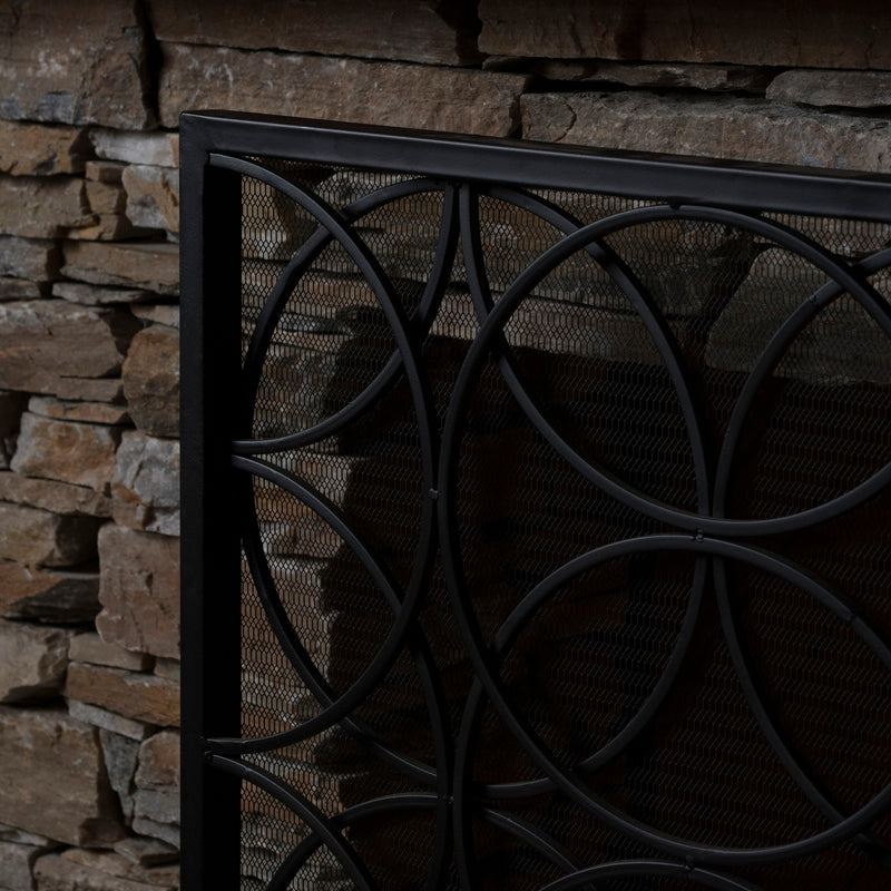 Noble House Thayer single panel iron fireplace screen with geometric design, featuring black metal construction and decorative pattern.