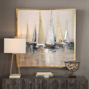 Uttermost Regatta nautical canvas art featuring blue maritime-themed artwork on a wall.