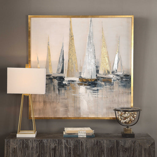 Uttermost Regatta nautical canvas art featuring blue maritime-themed artwork on a wall.
