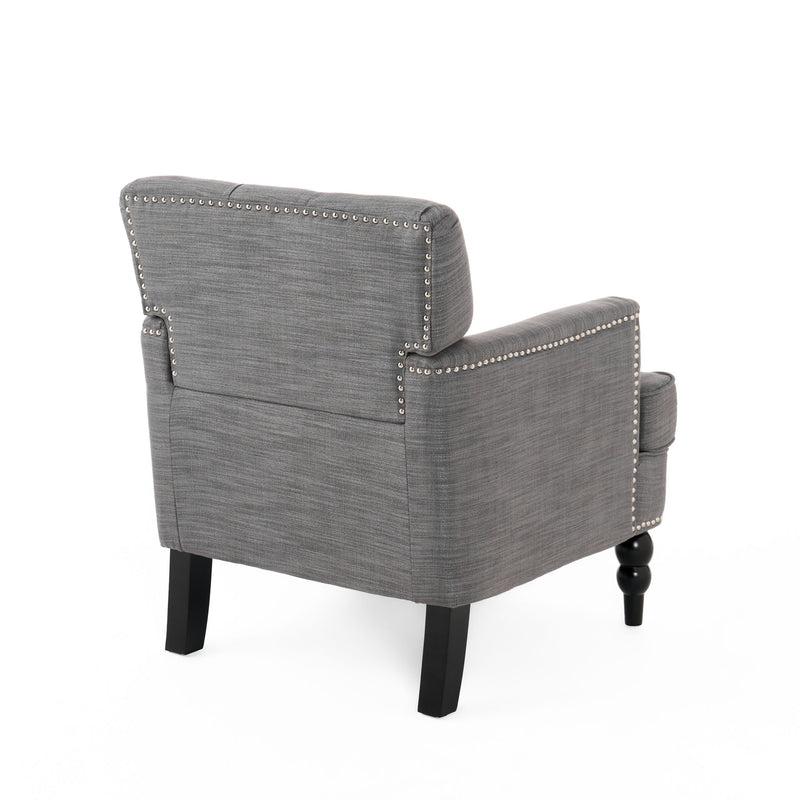 Noble House Harrison tufted club arm chair with button tufted back, upholstered fabric, and birch wood legs in a stylish living room setting.