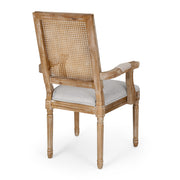 Noble House French Country style arm dining chair with cane backrest and elegant wooden frame, showcasing classic craftsmanship.