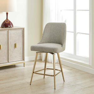 Gray upholstered counter stool with gold metal legs, 24-27 inch height, from Uttermost's Bramwell collection.