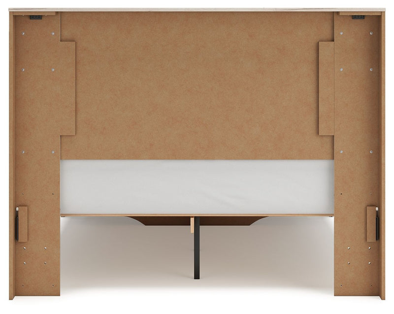 Signature Design by Ashley Lawroy panel storage bed with built-in drawers and storage compartments in a modern bedroom setting.