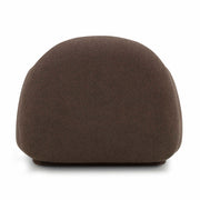 TOV Furniture Marius accent arm chair with plush fabric upholstery and sleek wooden legs in a modern living room setting.