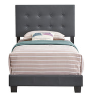 Upholstered Caldwell bed by Glory Furniture with a padded fabric headboard and frame in a modern bedroom setting.