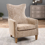 Light brown animal pattern armchair by Uttermost featuring a stylish, comfortable design with plush upholstery and wooden legs.