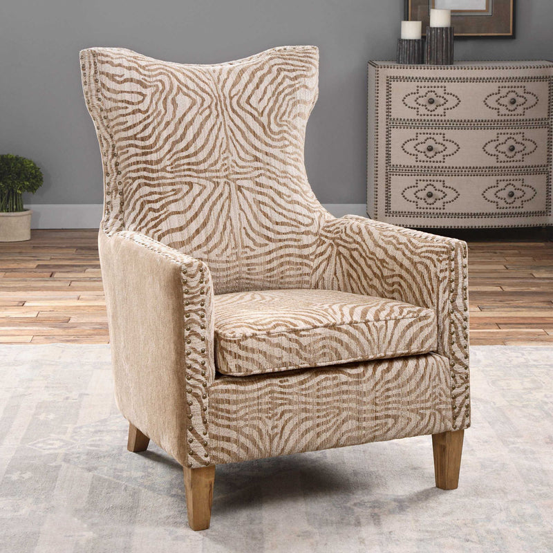 Light brown animal pattern armchair by Uttermost featuring a stylish, comfortable design with plush upholstery and wooden legs.