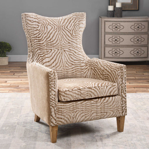 Light brown animal pattern armchair by Uttermost featuring a stylish, comfortable design with plush upholstery and wooden legs.