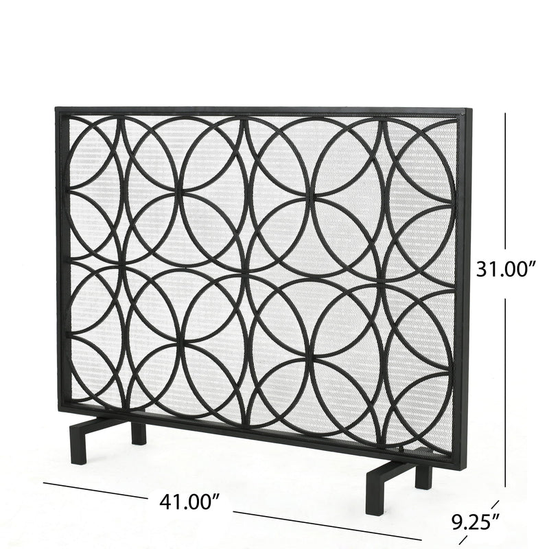 Noble House Thayer single panel iron fireplace screen with geometric design, featuring black metal and decorative cutouts.
